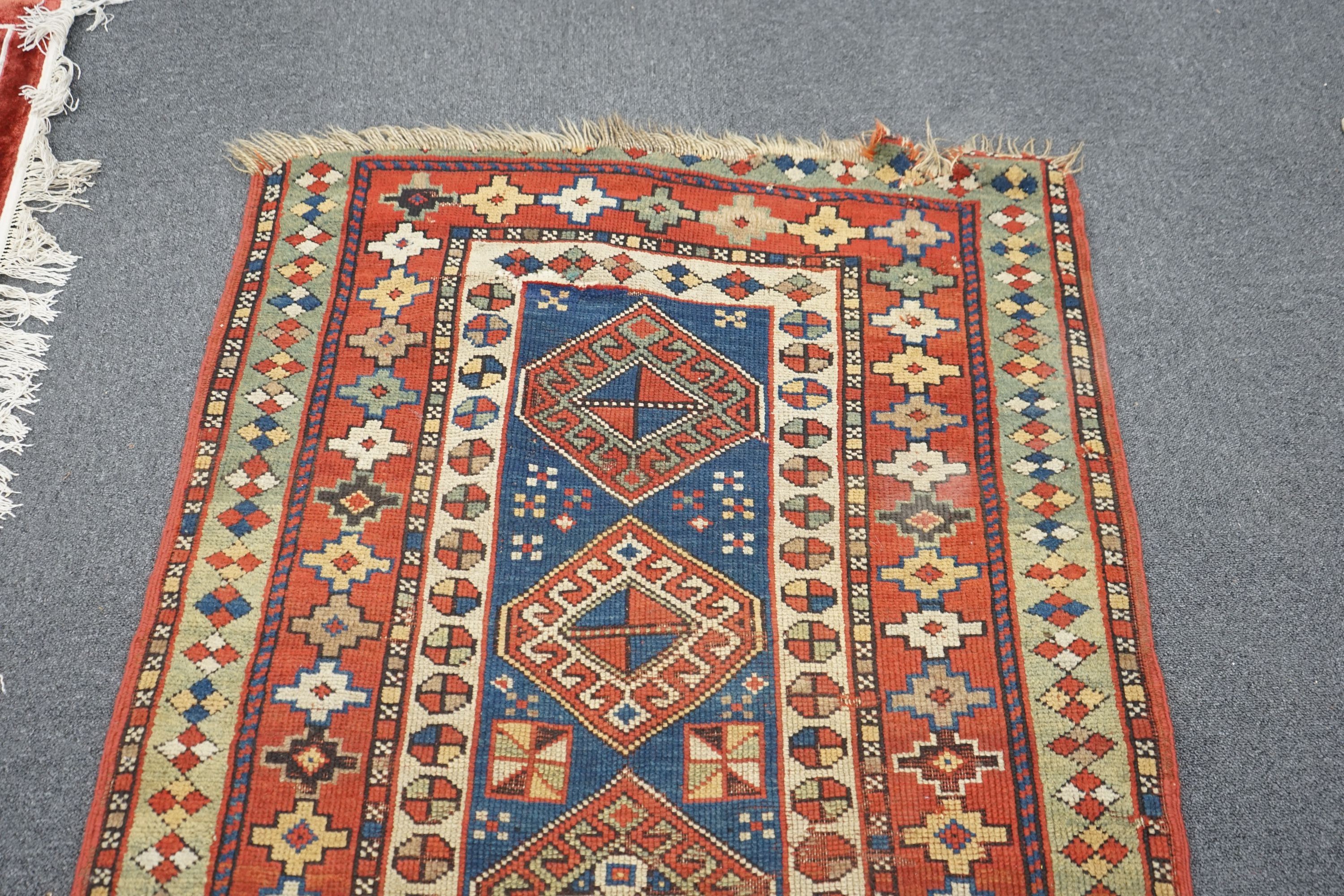 A Kazak blue ground rug, 152 x 95cm